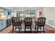 Kitchen features blue cabinets, stainless steel appliances, wine rack, and a breakfast bar with decorative seating at 761 Marina Point Dr # 7610, Daytona Beach, FL 32114