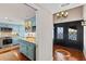 Bright kitchen flowing into a foyer with lake views through the double doors at 761 Marina Point Dr # 7610, Daytona Beach, FL 32114