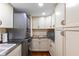 This laundry room features stainless steel countertops, cabinets and a washer/dryer at 761 Marina Point Dr # 7610, Daytona Beach, FL 32114