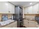 This laundry room features stainless steel countertops, cabinets and a washer/dryer at 761 Marina Point Dr # 7610, Daytona Beach, FL 32114