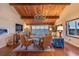 Bright living room featuring wood floors, a chandelier, and water views at 761 Marina Point Dr # 7610, Daytona Beach, FL 32114