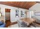 Comfortable living room featuring wood floors, built-in shelving, and a cozy seating area at 761 Marina Point Dr # 7610, Daytona Beach, FL 32114