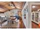 Living room area boasts vaulted ceilings, wood beams, and a cozy reading nook at 761 Marina Point Dr # 7610, Daytona Beach, FL 32114