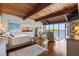 Serene main bedroom with waterfront view, wood ceiling, and seating area at 761 Marina Point Dr # 7610, Daytona Beach, FL 32114
