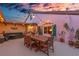 Inviting outdoor patio with charming string lights, stylish decor, and comfortable seating area at 761 Marina Point Dr # 7610, Daytona Beach, FL 32114