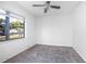 Bedroom features include a ceiling fan and window providing natural light at 816 W Franklin Ave, Deland, FL 32720