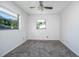 Bedroom with a ceiling fan and two windows providing natural light at 816 W Franklin Ave, Deland, FL 32720