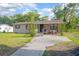 Charming single-story home featuring a classic design with a well-maintained front yard at 816 W Franklin Ave, Deland, FL 32720