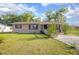 Inviting single-story residence offering a classic façade and a well-kept lawn at 816 W Franklin Ave, Deland, FL 32720