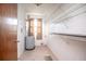Small laundry room with a water heater and shelving at 816 W Franklin Ave, Deland, FL 32720