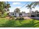 Spacious backyard with a patio area and lush greenery, ideal for outdoor activities at 82 Margaret Rd, Ormond Beach, FL 32176