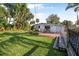 Lush backyard featuring a patio, a deck, and well-maintained lawn, perfect for relaxation and entertainment at 82 Margaret Rd, Ormond Beach, FL 32176