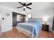 A bright bedroom features stylish decor, ceiling fan and tile floors at 82 Margaret Rd, Ormond Beach, FL 32176
