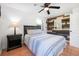 Stylish bedroom with modern decor, ceiling fan and wood accent wall at 82 Margaret Rd, Ormond Beach, FL 32176
