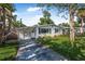 Charming home with lush green lawn and inviting curb appeal on a sunny day at 82 Margaret Rd, Ormond Beach, FL 32176