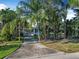 Charming home exterior with lush landscaping and a private driveway at 82 Margaret Rd, Ormond Beach, FL 32176