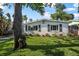 Well-maintained lawn and simple landscaping enhance the curb appeal of this cozy home at 82 Margaret Rd, Ormond Beach, FL 32176