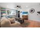 Cozy living room featuring colorful accent wall, tile floors, and comfortable seating at 82 Margaret Rd, Ormond Beach, FL 32176