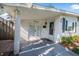 Enclosed porch features double doors and a charming welcome sign at 82 Margaret Rd, Ormond Beach, FL 32176