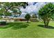 Expansive front lawn with mature trees, offering plenty of space and curb appeal at 910 N Kepler Rd, Deland, FL 32724