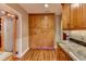 Kitchen with wood cabinets, pantry, and granite countertop at 910 N Kepler Rd, Deland, FL 32724