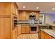 Modern kitchen with stainless steel oven and granite countertops at 910 N Kepler Rd, Deland, FL 32724