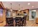 Kitchen island with granite countertop and barstool seating at 910 N Kepler Rd, Deland, FL 32724