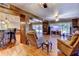 Open-concept living room with brick accent wall and access to the backyard pool at 910 N Kepler Rd, Deland, FL 32724