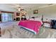 Spacious main bedroom with fireplace and sitting area, boasting a view of the water from the sliding door at 910 N Kepler Rd, Deland, FL 32724