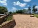 Brick paved patio features a basketball hoop and a garden, perfect for outdoor activities at 910 N Kepler Rd, Deland, FL 32724