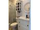 Well-lit bathroom with a sink vanity and decorative mirror at 935 S Atlantic Ave # 364, Daytona Beach, FL 32118