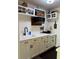 A renovated kitchen with white countertops and cabinets, and stainless steel appliances at 935 S Atlantic Ave # 364, Daytona Beach, FL 32118