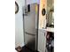 A kitchen with stainless steel refrigerator and white cabinets provide storage at 935 S Atlantic Ave # 364, Daytona Beach, FL 32118