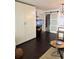 Open-concept living space with dark hardwood floors and ample storage at 935 S Atlantic Ave # 364, Daytona Beach, FL 32118