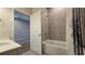 Cozy bathroom features a large mirror, toilet, and shower-tub combination with stylish tile and shower curtain at 1002 Chelan Falls Dr, Deland, FL 32724