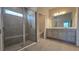 Bathroom featuring a glass shower and double sink vanity at 1002 Chelan Falls Dr, Deland, FL 32724