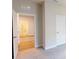 Bright bedroom features hardwood floors, fresh paint, and easy access to the bathroom through a hallway at 1002 Chelan Falls Dr, Deland, FL 32724