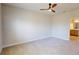 Spacious bedroom with plush carpeting and an ensuite bathroom with vanity at 1002 Chelan Falls Dr, Deland, FL 32724