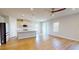 Contemporary kitchen with stainless steel appliances, white cabinets, island and wood floors at 1002 Chelan Falls Dr, Deland, FL 32724