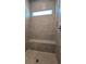 A tile shower with a built-in bench and a window at 1002 Chelan Falls Dr, Deland, FL 32724