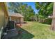 A spacious backyard featuring a manicured lawn and brick pathway at 101 Sweetwater Oaks Ln, Daytona Beach, FL 32114