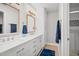 The bathroom boasts double sinks, framed mirrors, modern fixtures, and tiled walk-in shower at 101 Sweetwater Oaks Ln, Daytona Beach, FL 32114
