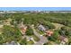 This scenic aerial shows a peaceful neighborhood with mature trees, offering a blend of nature and residential comfort at 101 Sweetwater Oaks Ln, Daytona Beach, FL 32114