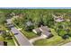 Well-maintained home featuring mature landscaping and a long driveway leading to an attached two-car garage at 101 Sweetwater Oaks Ln, Daytona Beach, FL 32114