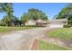 A cozy one-story home with an attached garage and well-maintained front yard on a sunny day at 101 Sweetwater Oaks Ln, Daytona Beach, FL 32114
