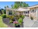 Beautiful home featuring a landscaped front yard with lovely plants and an inviting entrance way at 101 Sweetwater Oaks Ln, Daytona Beach, FL 32114