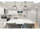 Bright and modern kitchen with a large island, stainless steel appliances, and ample counter space at 101 Sweetwater Oaks Ln, Daytona Beach, FL 32114