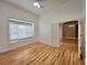 Bedroom with hardwood floors and large window overlooking the outdoors at 1072 Ceasars Ct, Mount Dora, FL 32757