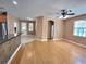 Open-concept kitchen featuring tile flooring, wood cabinets, and a breakfast bar at 1072 Ceasars Ct, Mount Dora, FL 32757