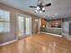 Spacious kitchen featuring hardwood floors, granite countertops, and stainless steel appliances at 1072 Ceasars Ct, Mount Dora, FL 32757